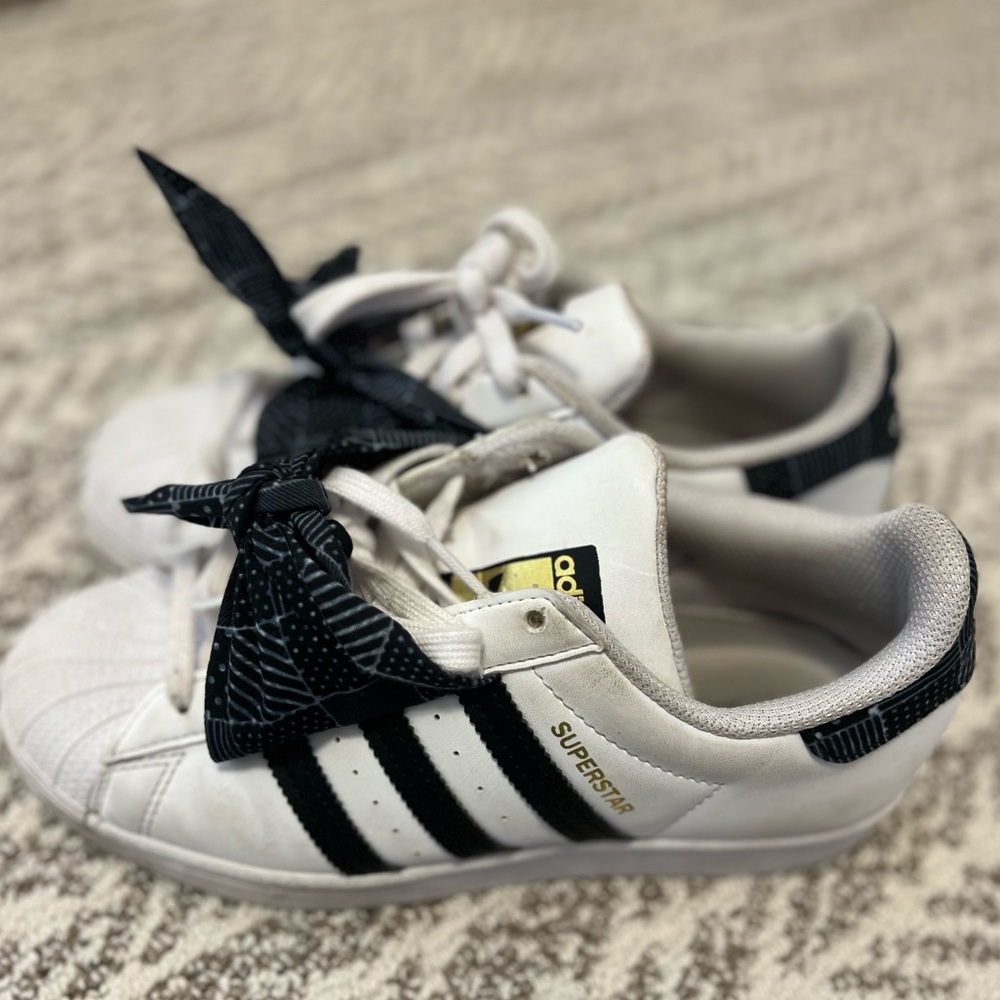 The cutest adidas superstar sneakers. Bow detail
